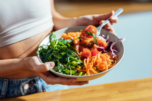 Colorful bowls of vegetables, grains, and proteins arranged for meal prep
